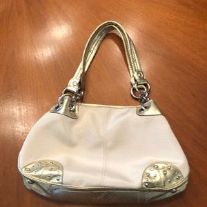 Kathy Van Zeeland canvas bag with gold accents and studs